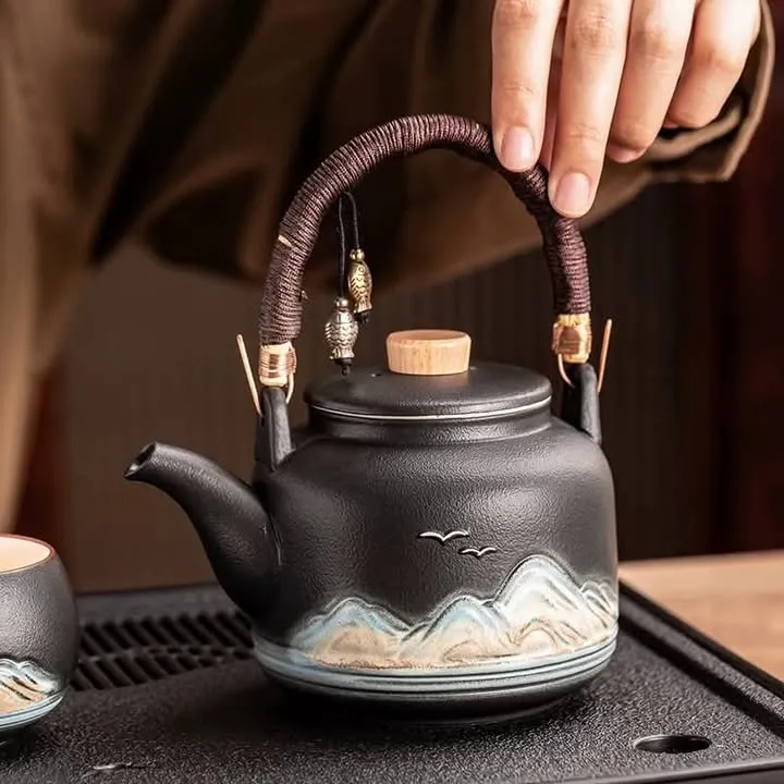 black printed ketle with handle